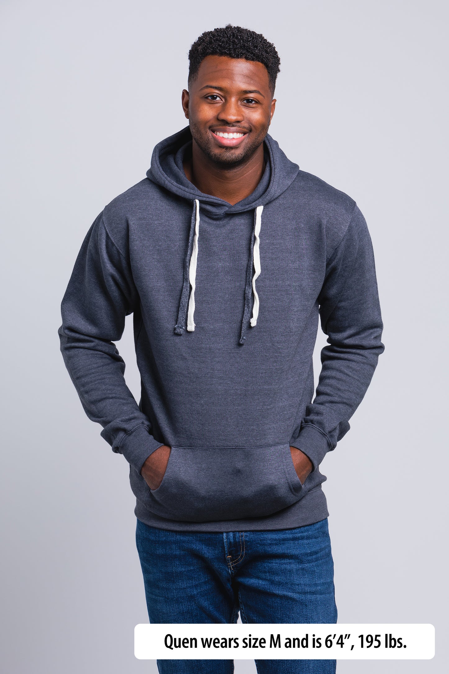 Have It Tall Hoodie worn by a male model (6'4" tall) wearing a size Medium Heather Charcoal standing in a tall apparel showroom.