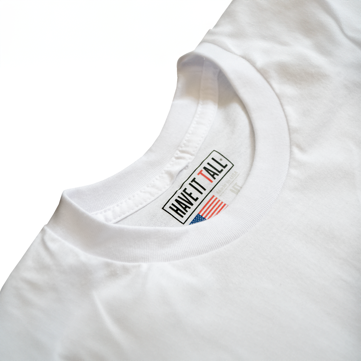 close up shot of Have It Tall made in USA T shirt in white 100% cotton luxury soft tee for tall men and women against a white background