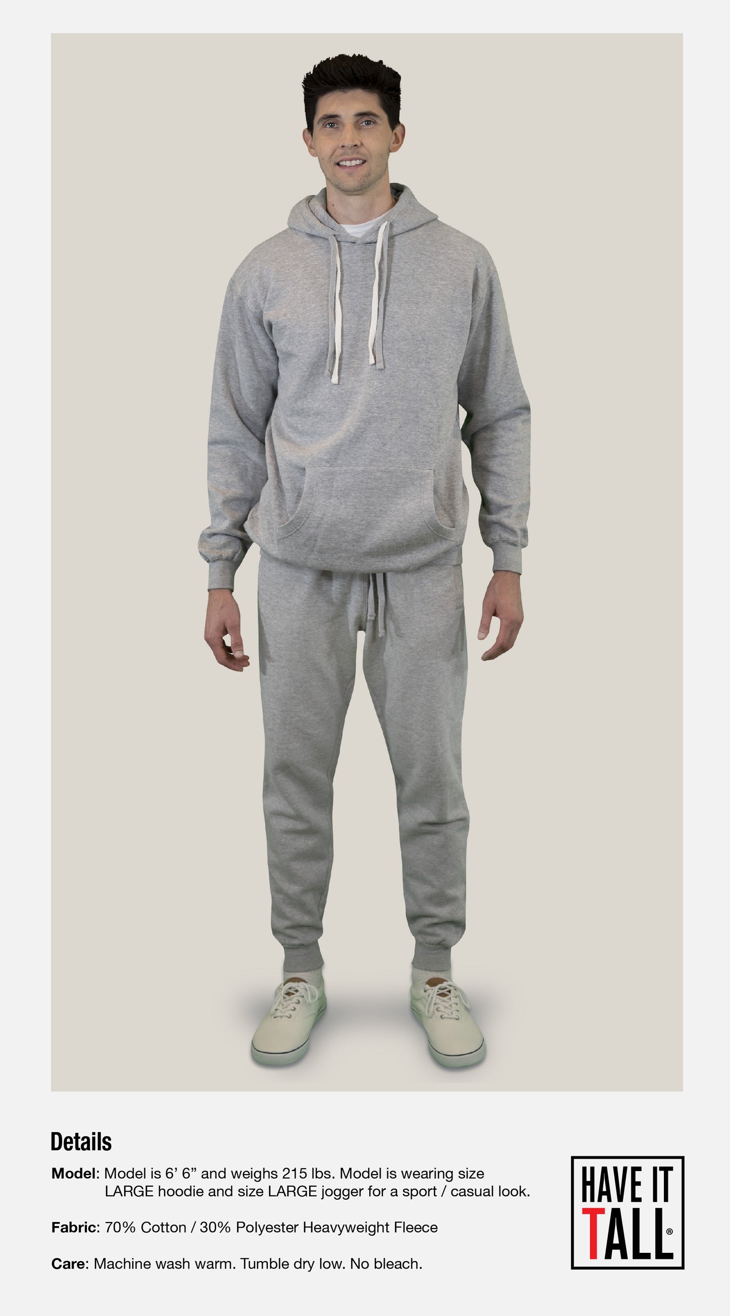 Tall male model 6'6 wearing gray joggers sweat pants for comfort against a white background