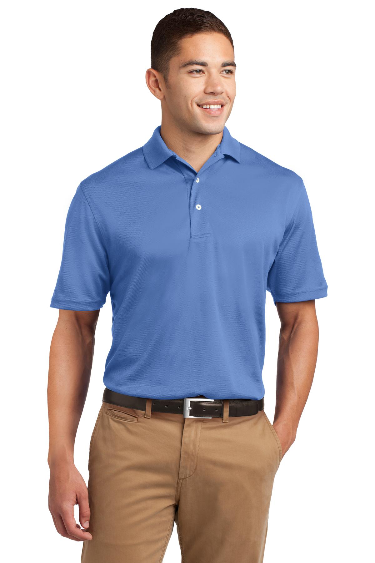 Tall male model 6'4 wearing a medium Sport-Tek Tall Dri-Mesh Polo in color blue berry 100% polyester tee shirt against a white background