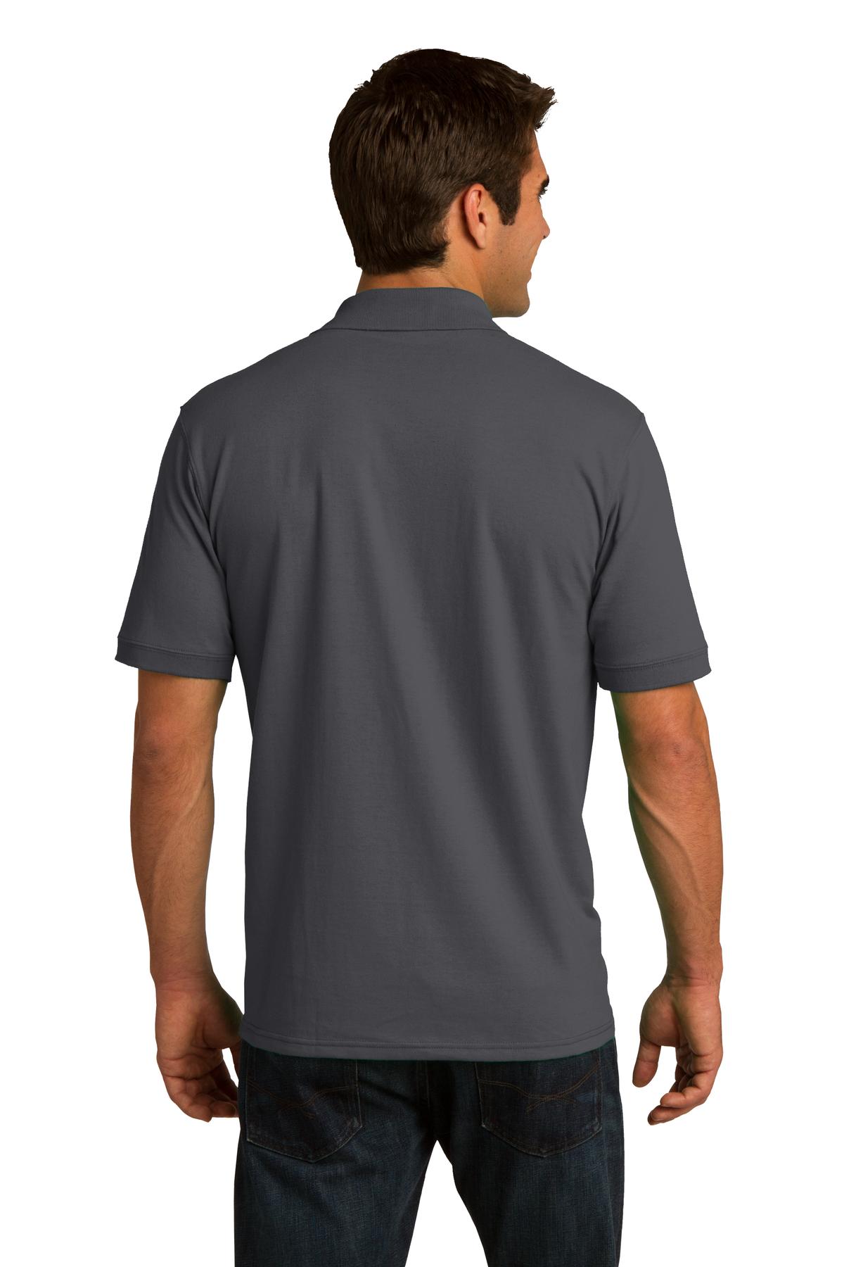 tall male model 6,4 wearing a charcoal medium port company polo t shirt with dyed to match buttons showing the back of the shirt against a white background