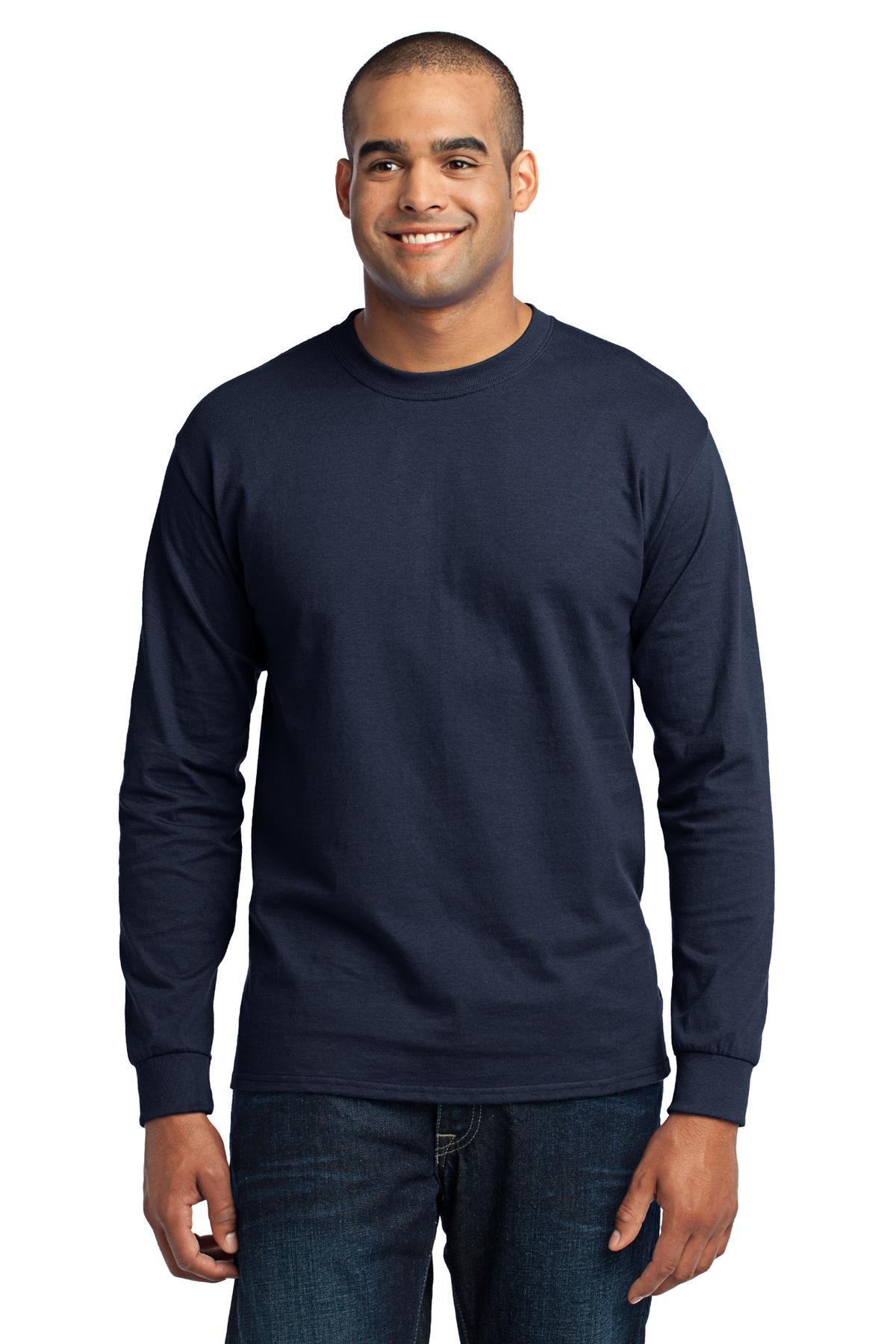 Tall male model 6'5 wearing a navy port company long sleeve t shirt comfortable soft and durable Tee against a white background