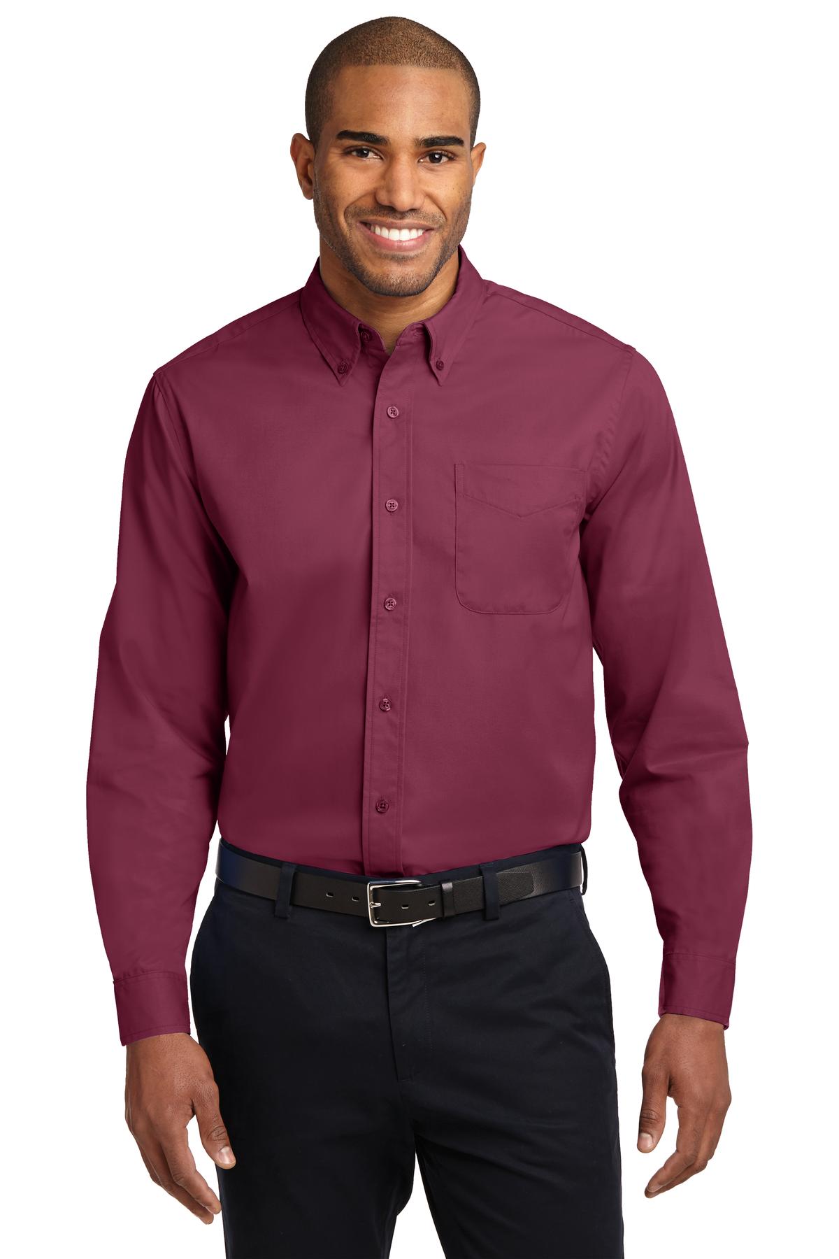 Tall male model 6,3 wearing a large long sleeve port authority button up shirt with chest pocket in color Burgundy against a white background