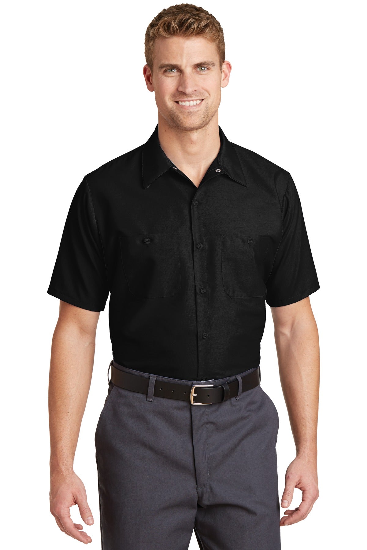 Tall male model 6'3 wearing a medium Red Kap Long Size Short Sleeve button up tee shirt Industrial Work Shirt in black with dyed buttons against a white background