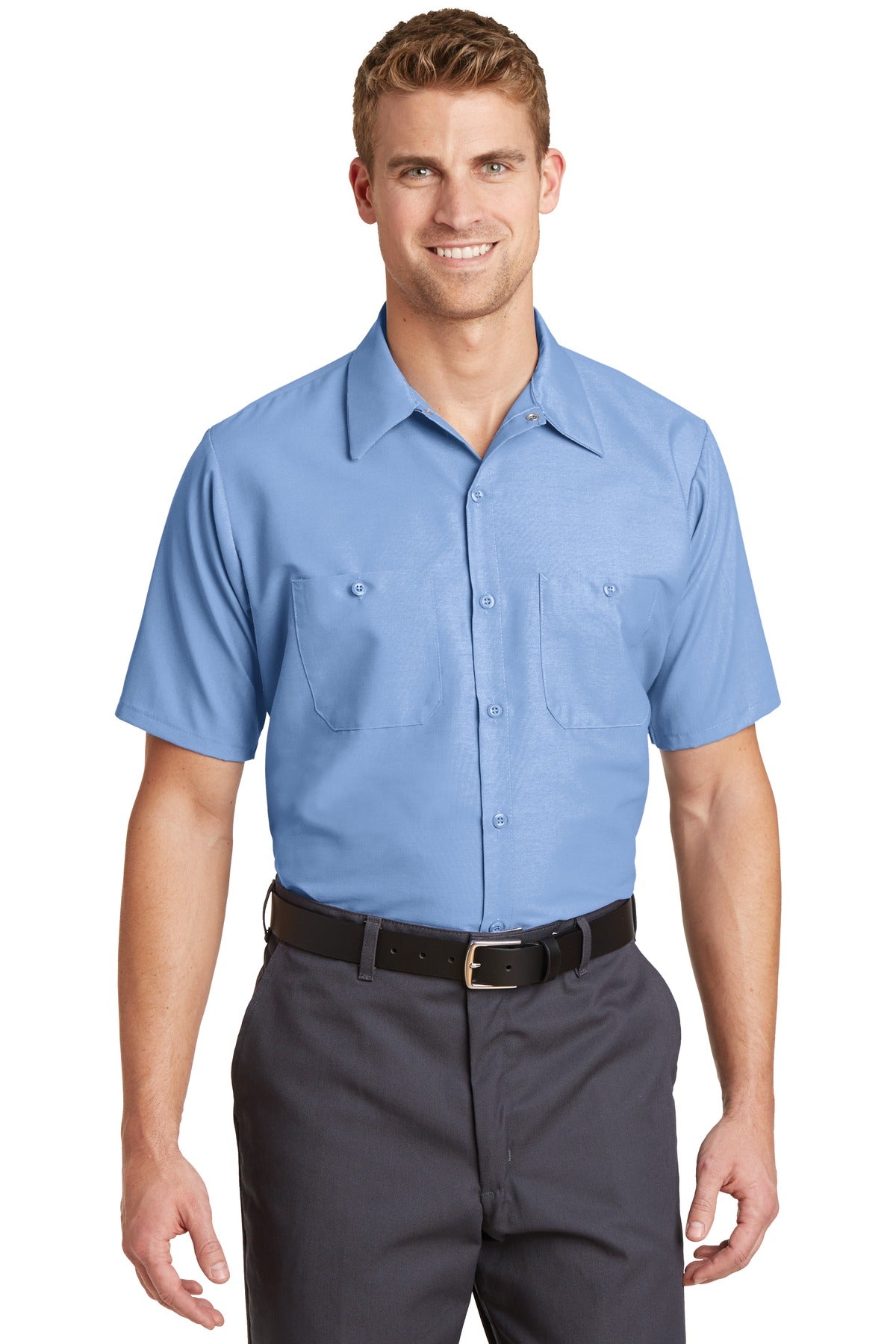 Tall male model 6'3 wearing a medium Red Kap Long Size Short Sleeve button up tee shirt Industrial Work Shirt in light blue with dyed buttons against a white background