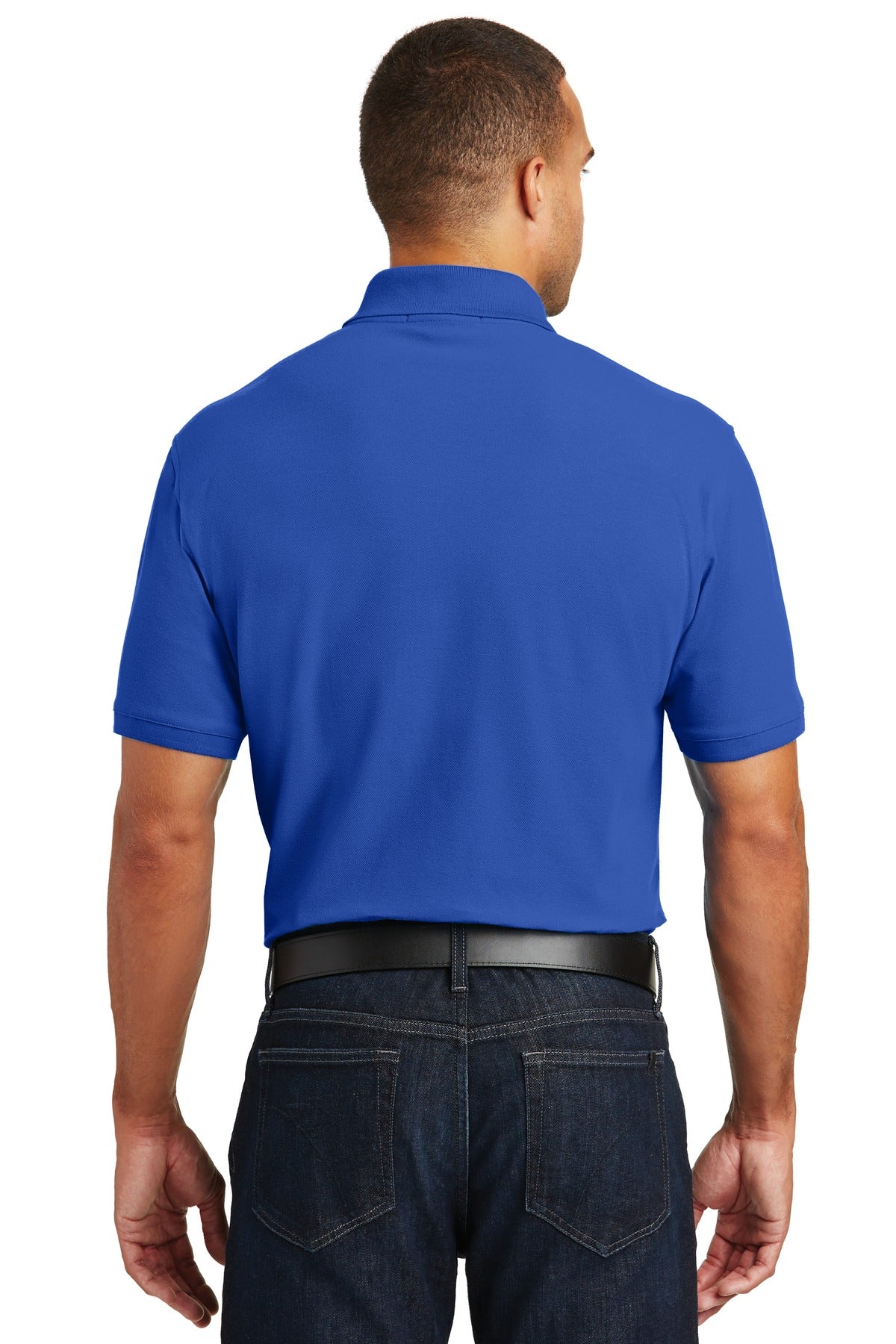 Tall male model 6'4 wearing a medium true royal Port Authority Tall Core Classic Pique Polo built for durability showing the back of the shirt against a white background