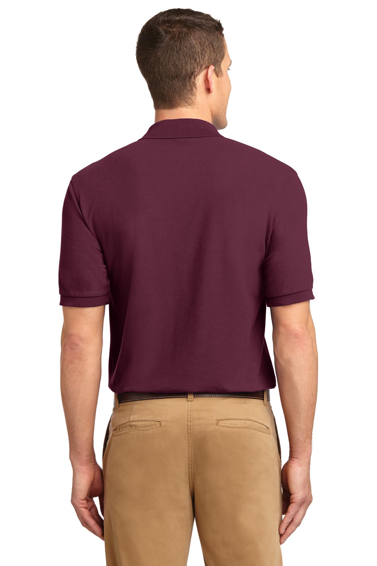 Tall male model 6'3 wearing a small Port Authority Tall Silk Touch Polo in color burgundy with dyed buttons cotton/poly blend showing the back of the shirt against a white background