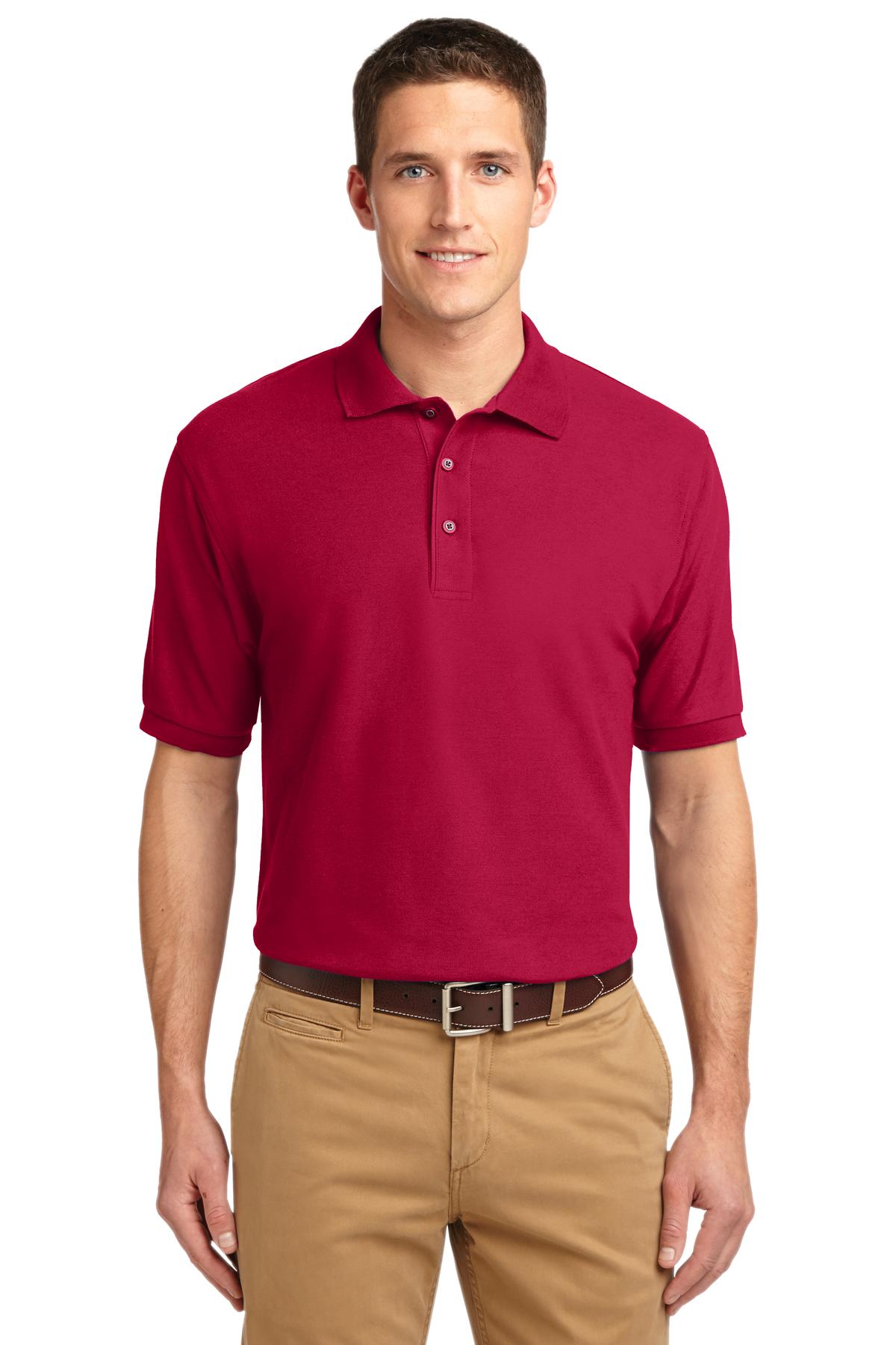 Tall male model 6'3 wearing a small Port Authority Tall Silk Touch Polo in color red with dyed buttons cotton/poly blend against a white background