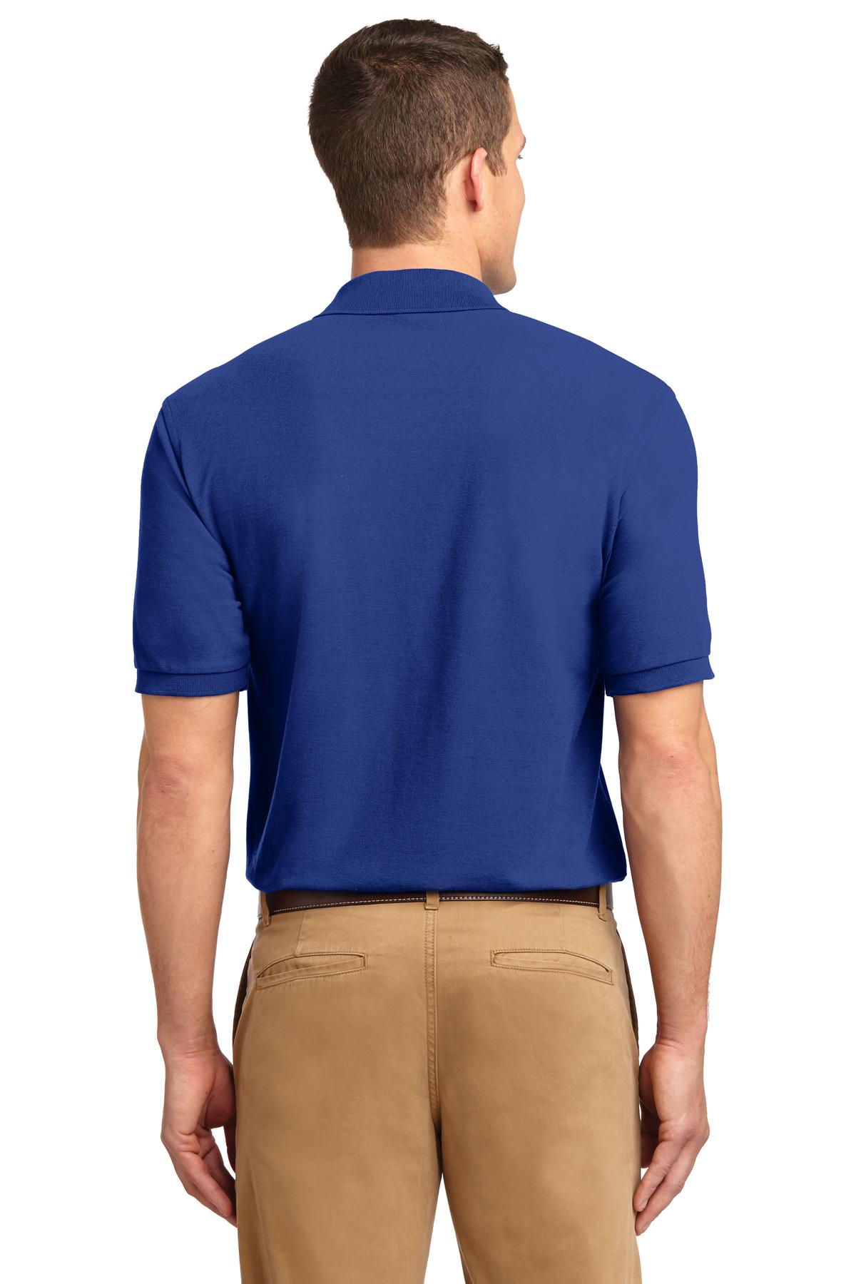 Tall male model 6'3 wearing a small Port Authority Tall Silk Touch Polo in color royal with dyed buttons cotton/poly blend showing the back of the shirt against a white background