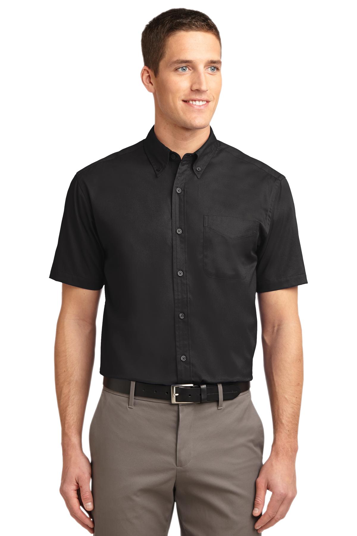 Tall male model 6,3 wearing a medium black button up port authority polo with left chest pocket against a white background