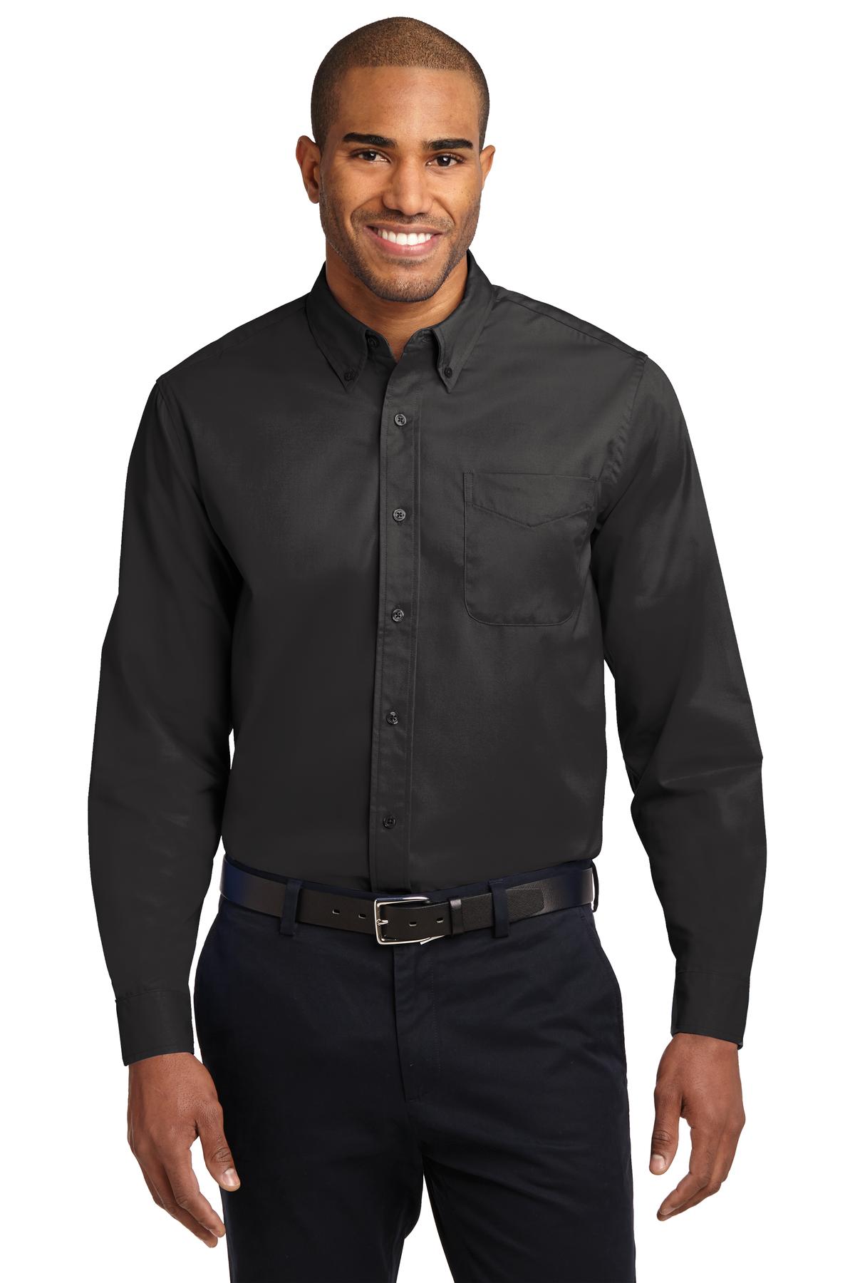 Tall male model 6,3 wearing a large long sleeve port authority button up shirt with chest pocket in color Black against a white background