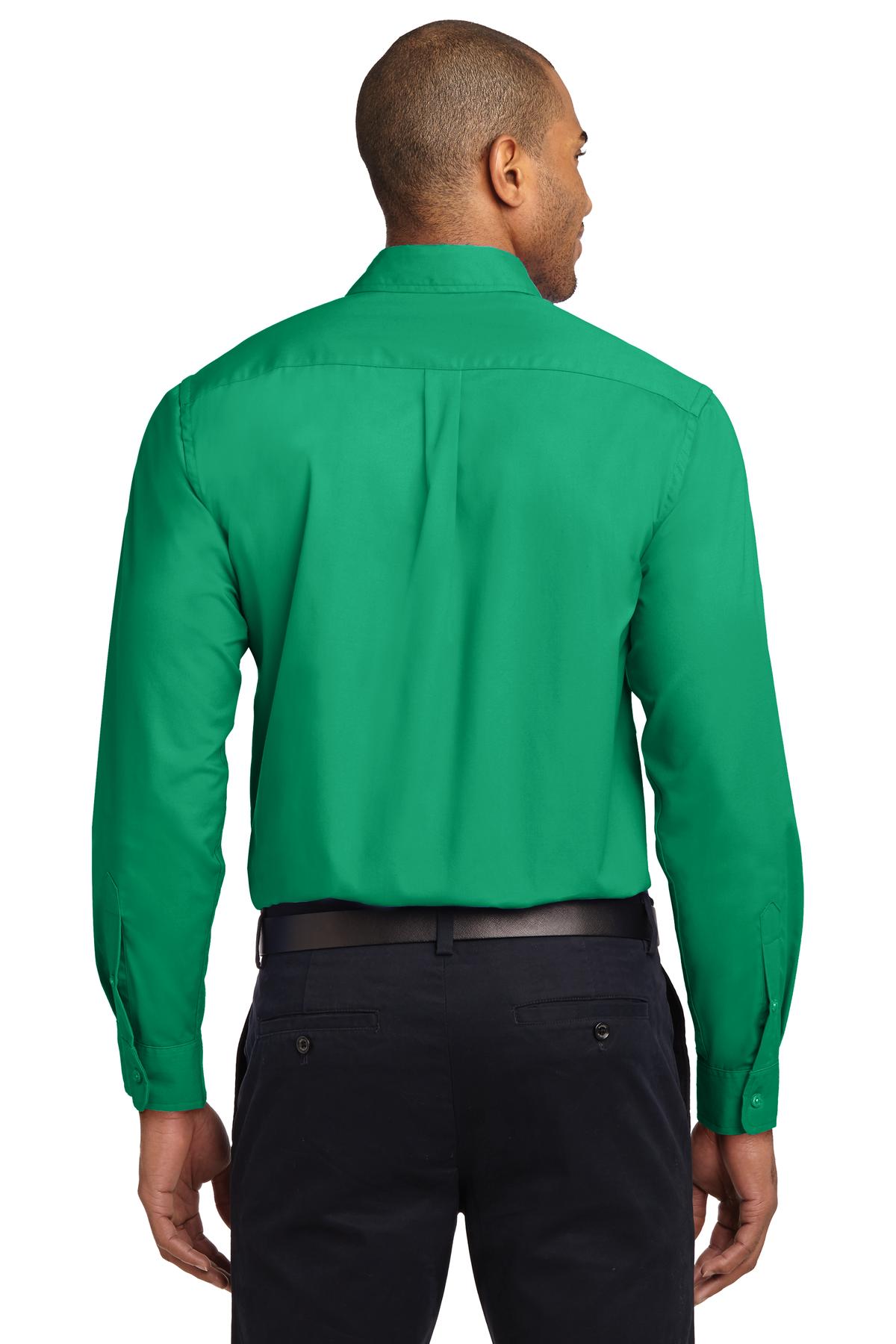 Tall male model 6,3 wearing a Medium long sleeve port authority button up shirt with chest pocket in color court green showing the back of the shirt against a white background