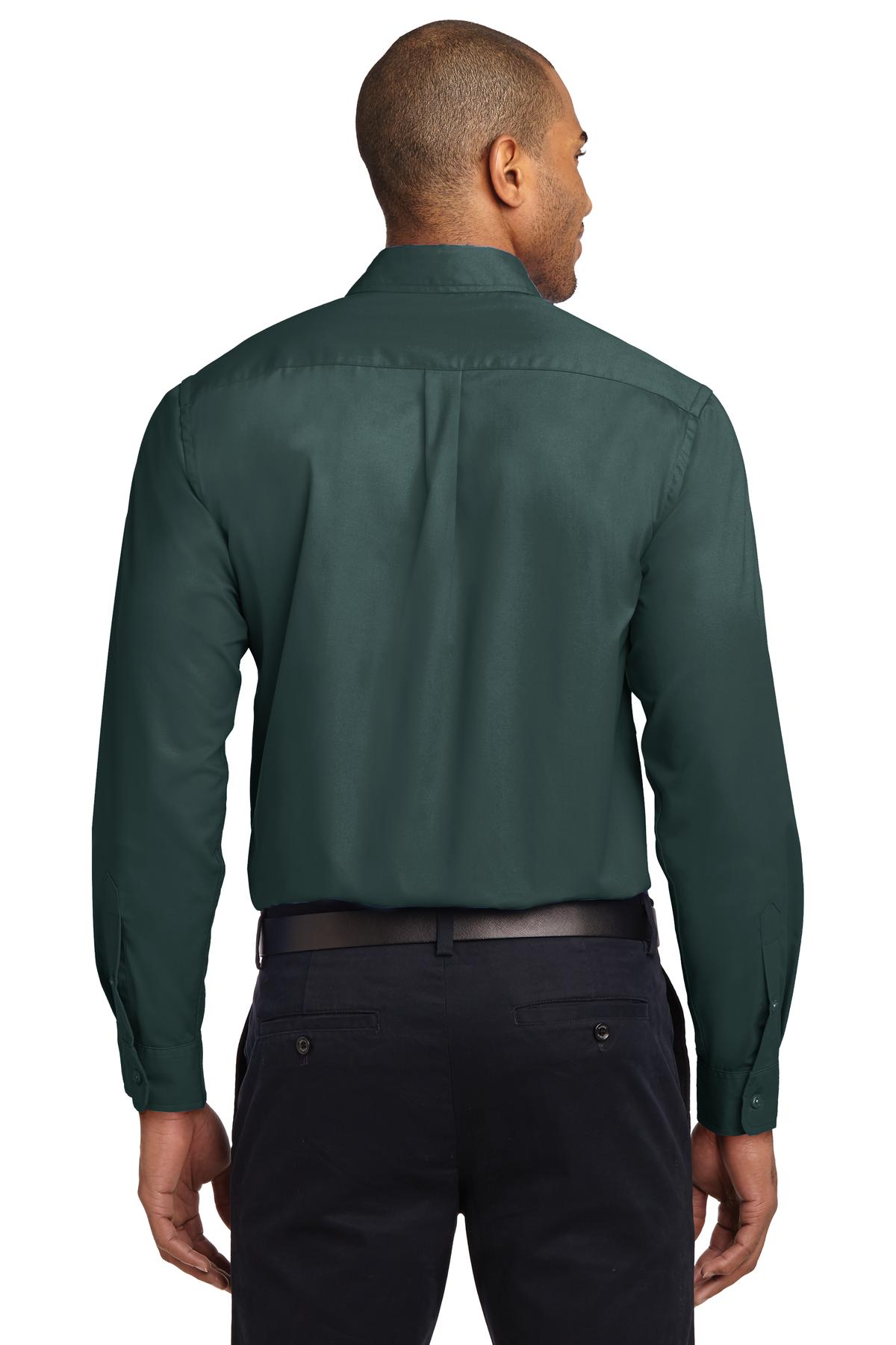 Tall male model 6,3 wearing a Medium long sleeve port authority button up shirt with chest pocket in color dark green showing the back of the shirt against a white background