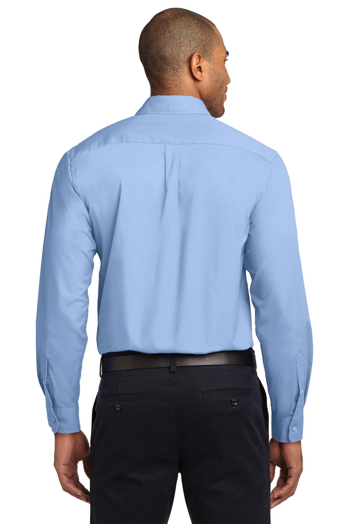 Tall male model 6,3 wearing a Medium long sleeve port authority button up shirt with chest pocket in color light blue showing the back of the shirt against a white background