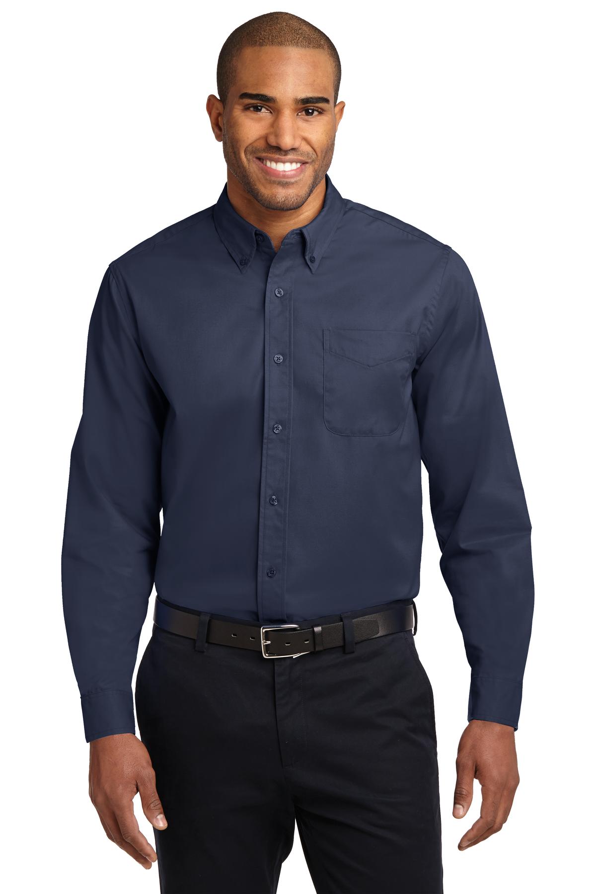 Tall male model 6,3 wearing a large long sleeve port authority button up shirt with chest pocket in color navy against a white background