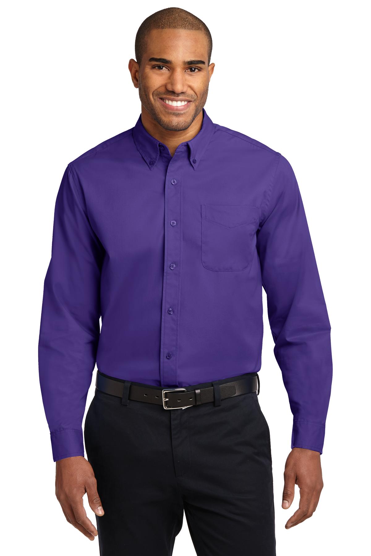 Tall male model 6,3 wearing a large long sleeve port authority button up shirt with chest pocket in color purple against a white background