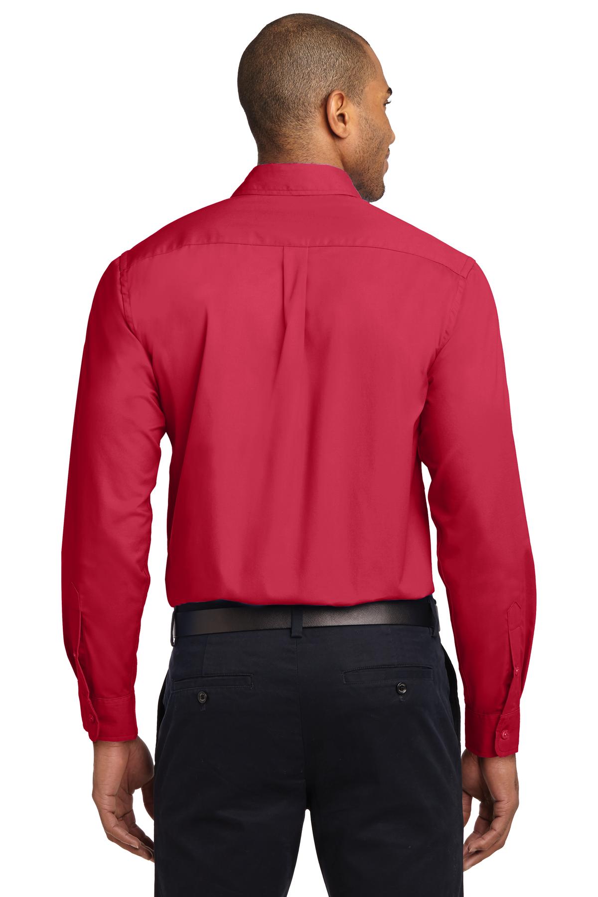 Tall male model 6,3 wearing a Medium long sleeve port authority button up shirt with chest pocket in color red showing the back of the shirt against a white background