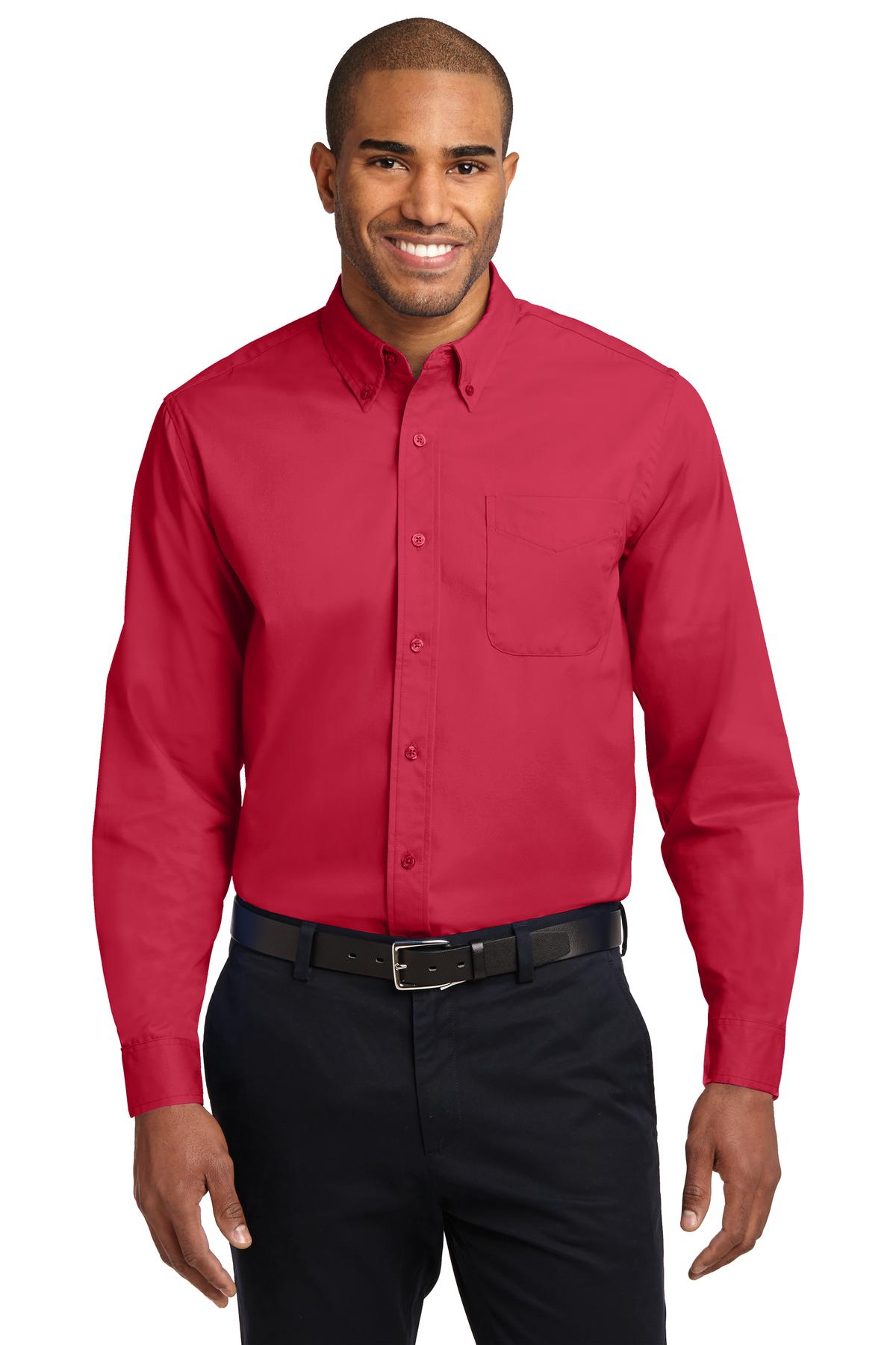 Tall male model 6,3 wearing a large long sleeve port authority button up shirt with chest pocket in color red against a white background