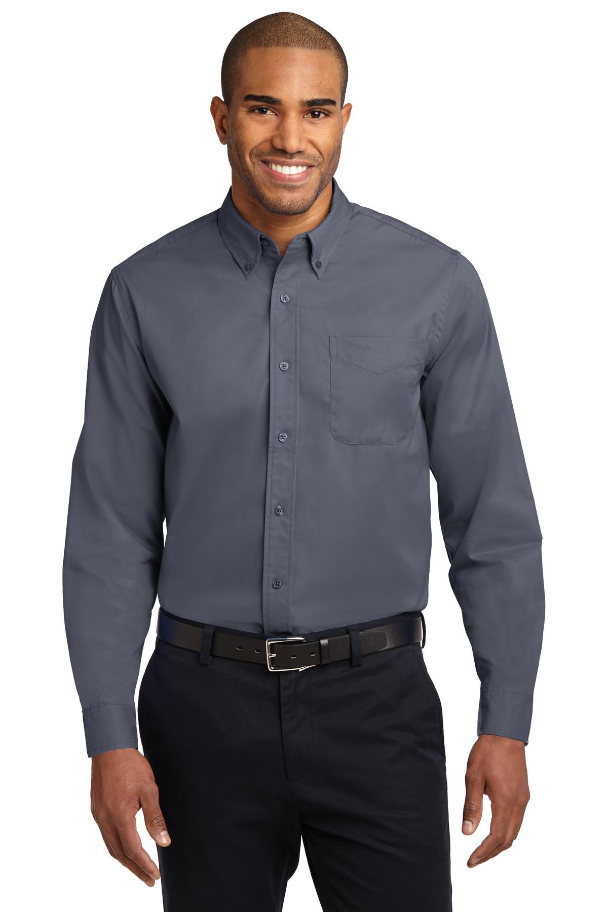 Tall male model 6,3 wearing a large long sleeve port authority button up shirt with chest pocket in color steel grey against a white background