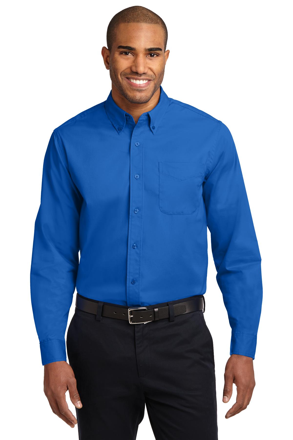 Tall male model 6,3 wearing a large long sleeve port authority button up shirt with chest pocket in color strong blue against a white background