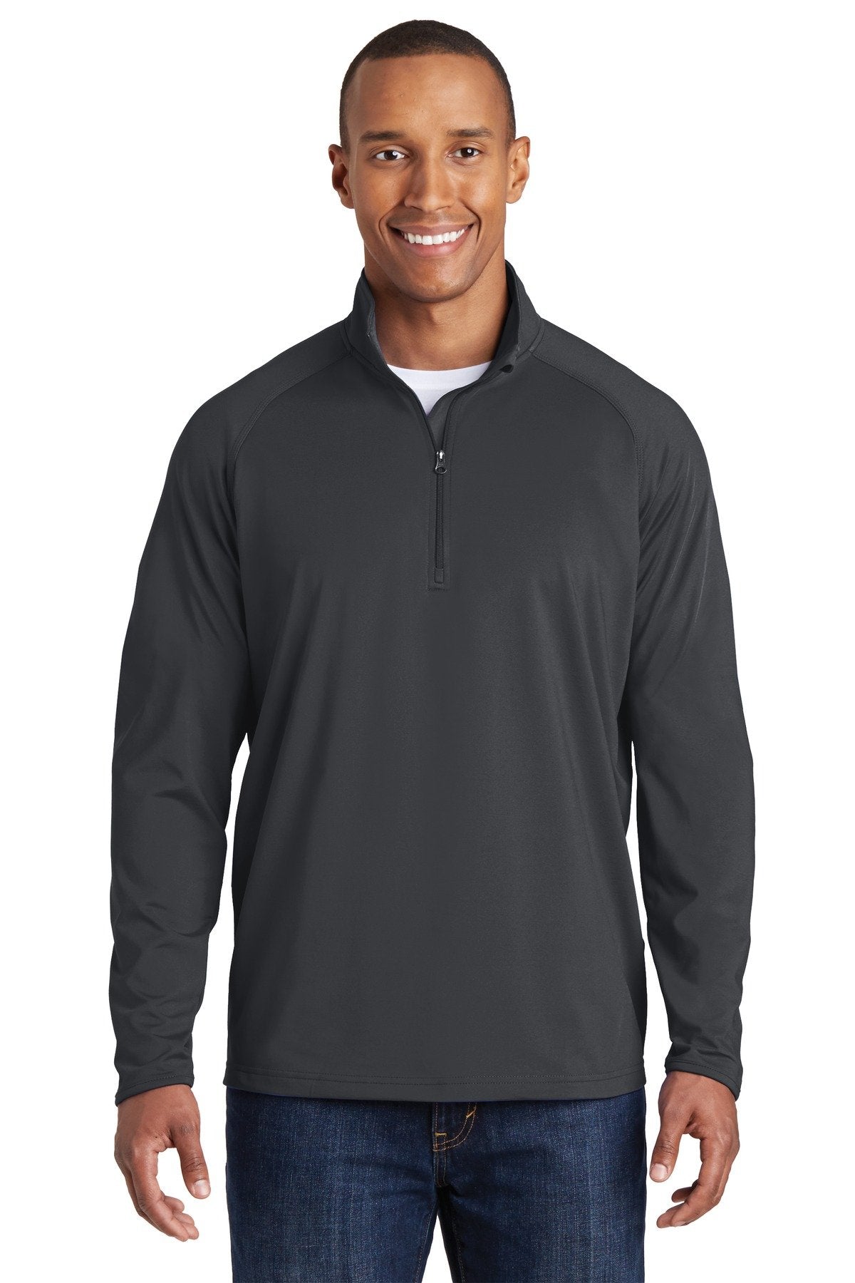 Tall male model 6'5 wearing a sport tek charcoal grey colored medium sport wick 90/10 poly/spandex designed for comfort against a white background