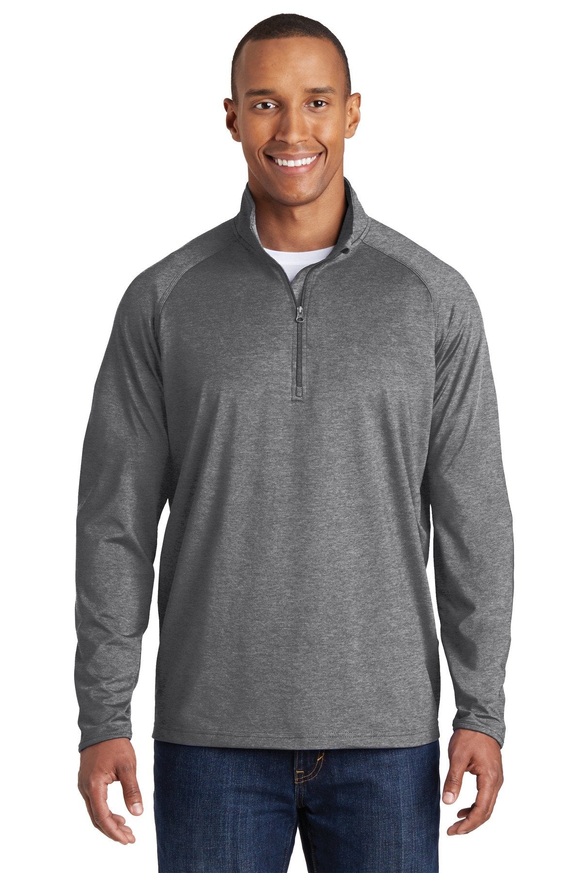 Tall male model 6'5 wearing a sport tek charcoal grey heather colored medium sport wick 90/10 poly/spandex designed for comfort against a white background