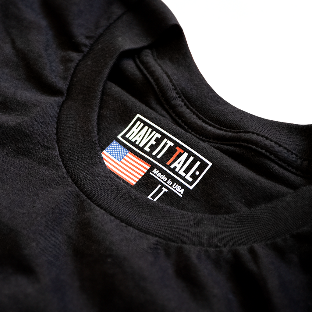 close up shot of Have It Tall made in USA T shirt in black 100% cotton luxury soft tee for tall men and women against a white background
