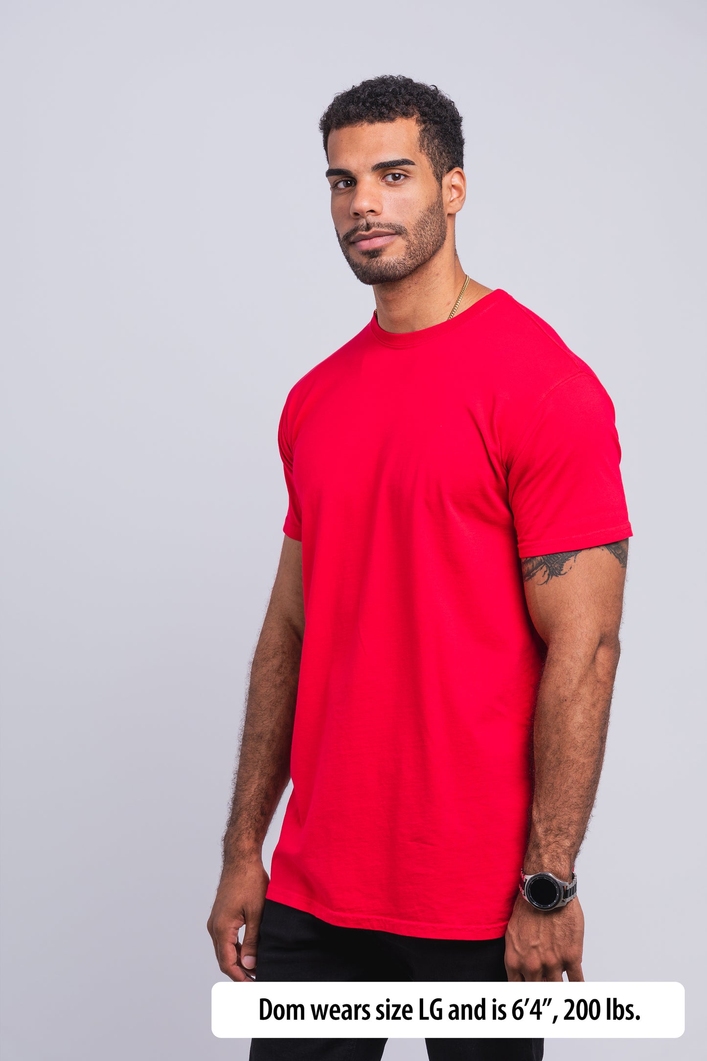Have It Tall Classic Tall T Shirt worn by a male model (6'4" tall) wearing a size large  red standing in a tall apparel showroom.