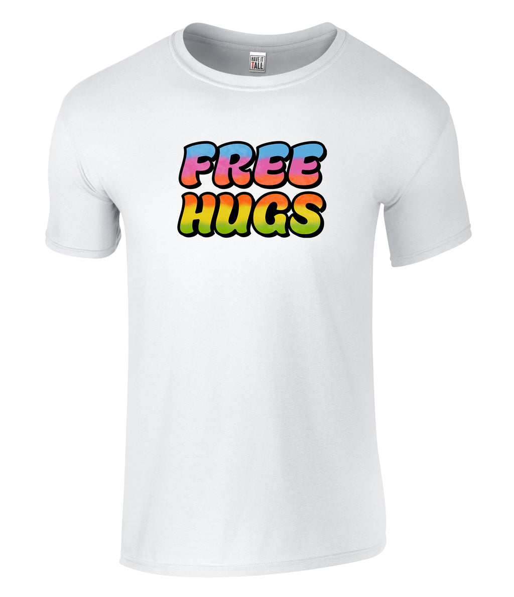 A white short-sleeve crewneck t-shirt featuring a colorful retro-style graphic on the chest that reads 'FREE HUGS' in a rainbow gradient with black outlines.
