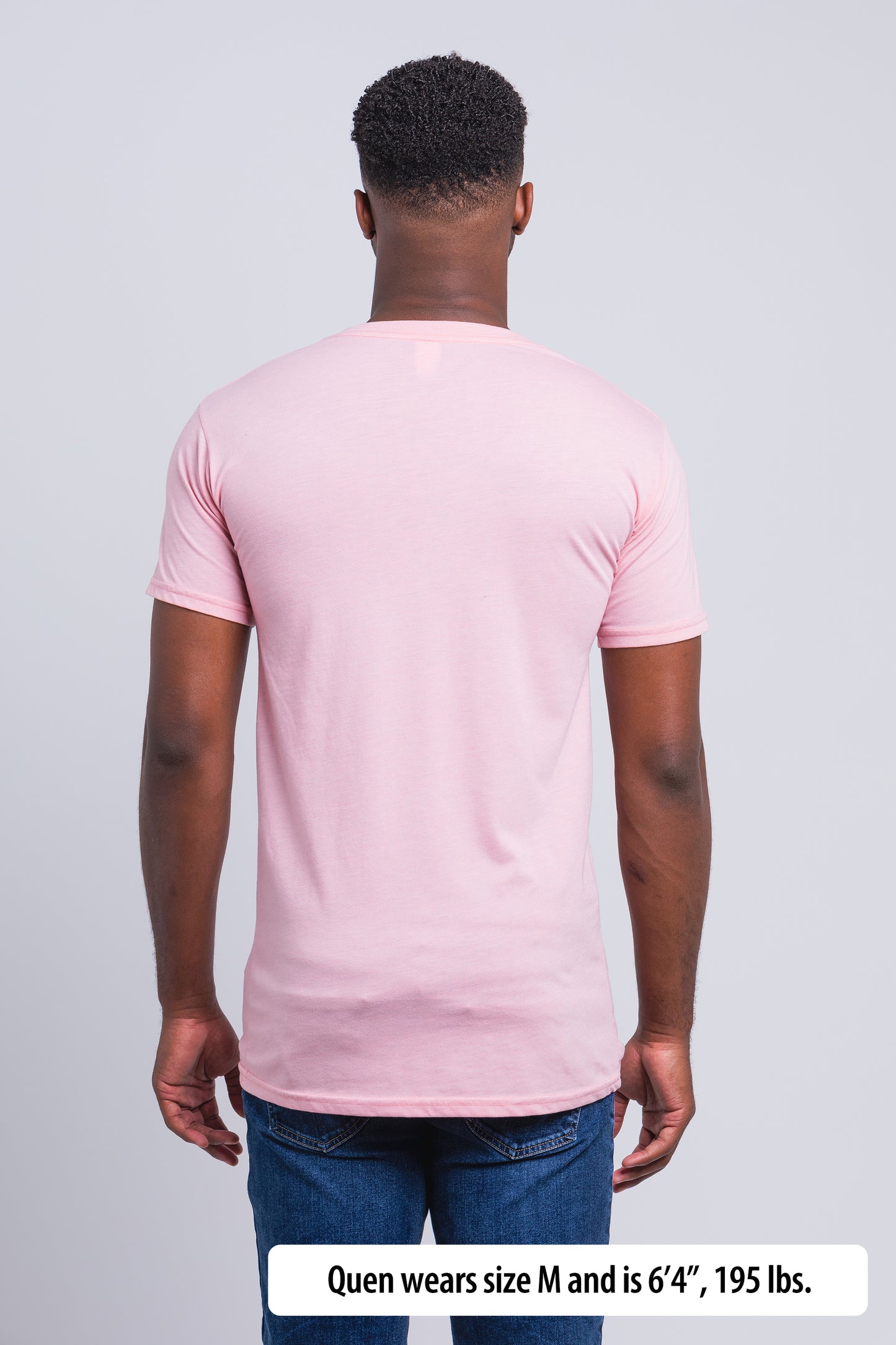 Have It Tall V-Neck Tall T-Shirt worn by a male model (6'4" tall) wearing a size Medium Rose standing in a tall apparel showroom.