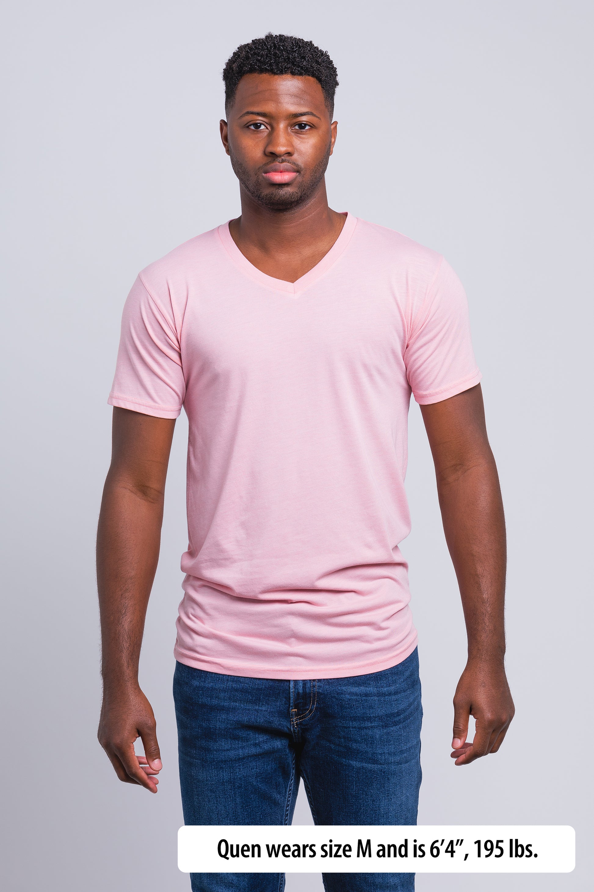 Have It Tall V-Neck Tall T-Shirt worn by a male model (6'4" tall) wearing a size Medium Rose standing in a tall apparel showroom.