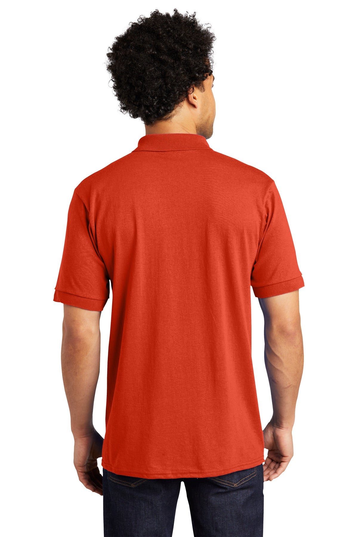 tall male model 6,4 wearing an orange medium port company polo t shirt with dyed to match buttons showing the back of the shirt against a white background