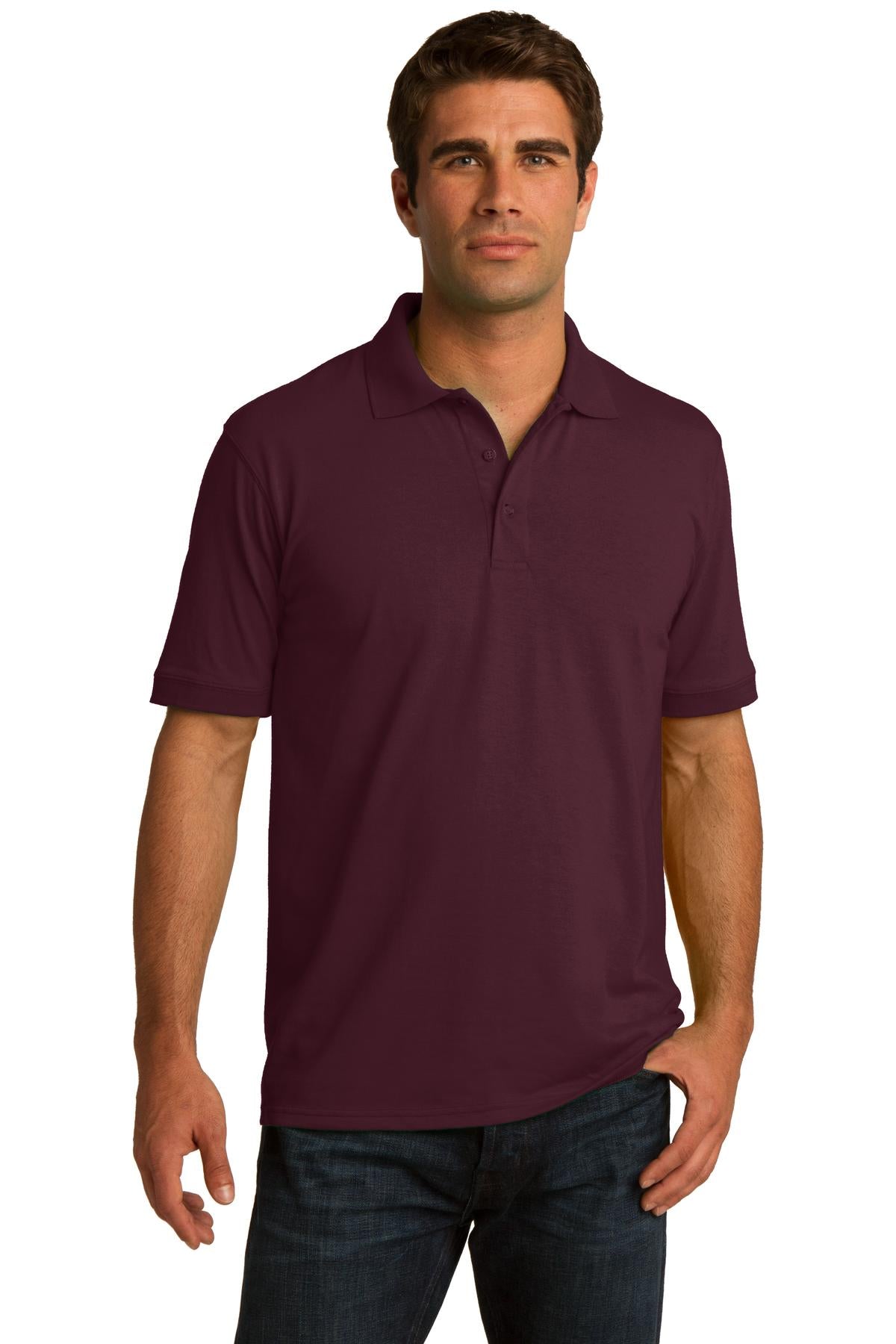 tall male model 6,4 wearing an athletic maroon medium port company polo t shirt with dyed to match buttons against a white background