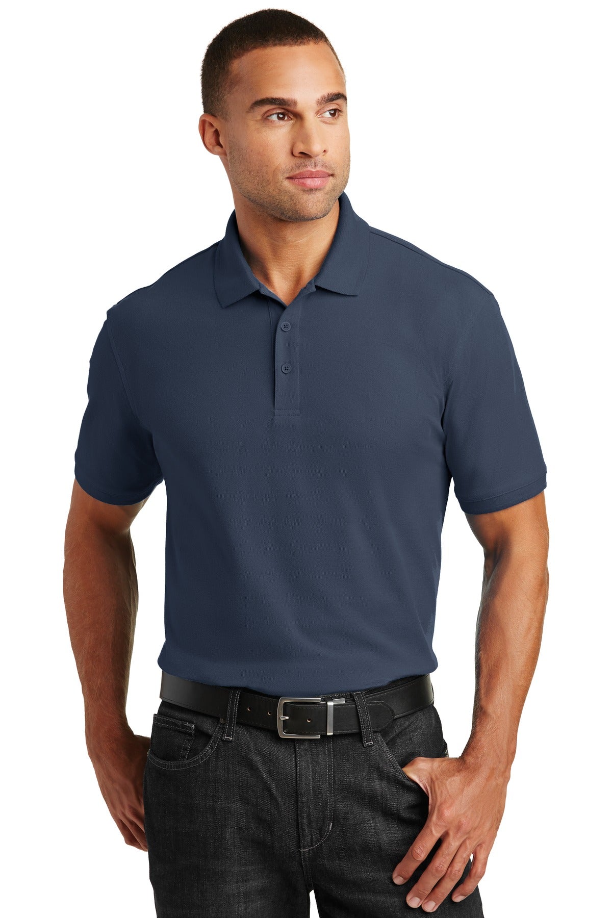 Tall male model 6'4 wearing a medium river blue navy Port Authority Tall Core Classic Pique Polo built for durability against a white background