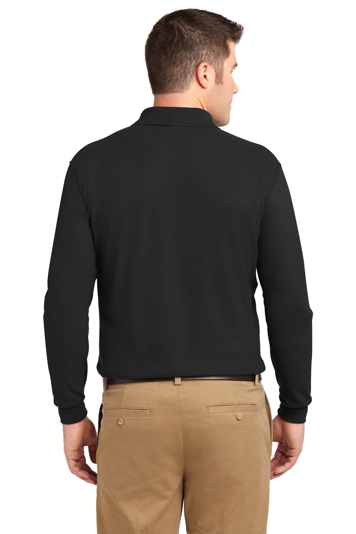 Tall male model 6'6 wearing a large black Port Authority Tall Silk Touch Long Sleeve Polo showing the back of the shirt against a white background