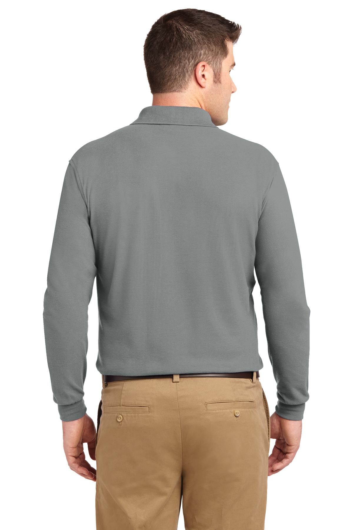 Tall male model 6'6 wearing a large cool grey Port Authority Tall Silk Touch Long Sleeve Polo showing the back of the shirt against a white background