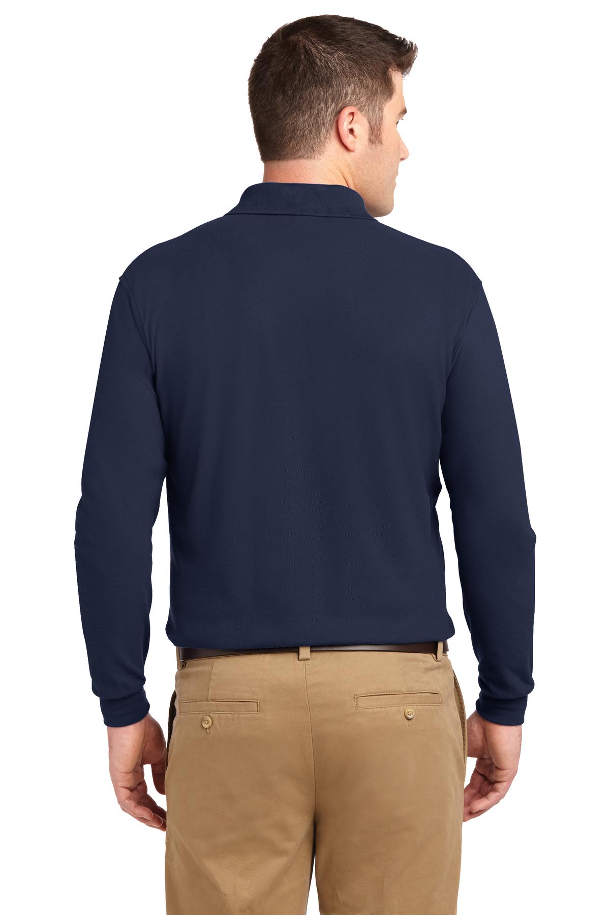 Tall male model 6'6 wearing a large navy Port Authority Tall Silk Touch Long Sleeve Polo showing the back of the shirt against a white background