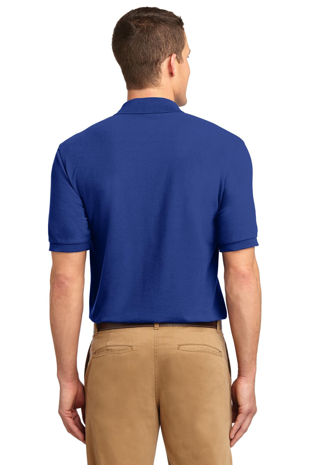Tall male model 6'3 wearing a small Port Authority Tall Silk Touch Polo in color royal with dyed buttons cotton/poly blend showing the back of the shirt against a white background