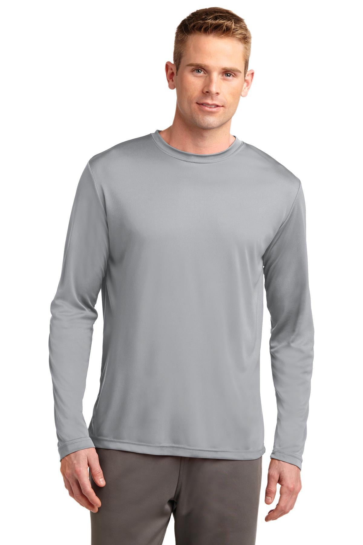 Tall male model 6,4 wearing a silver sport tek long sleeve T shirt 100% poly Tee with removable tag for comfort against a white background