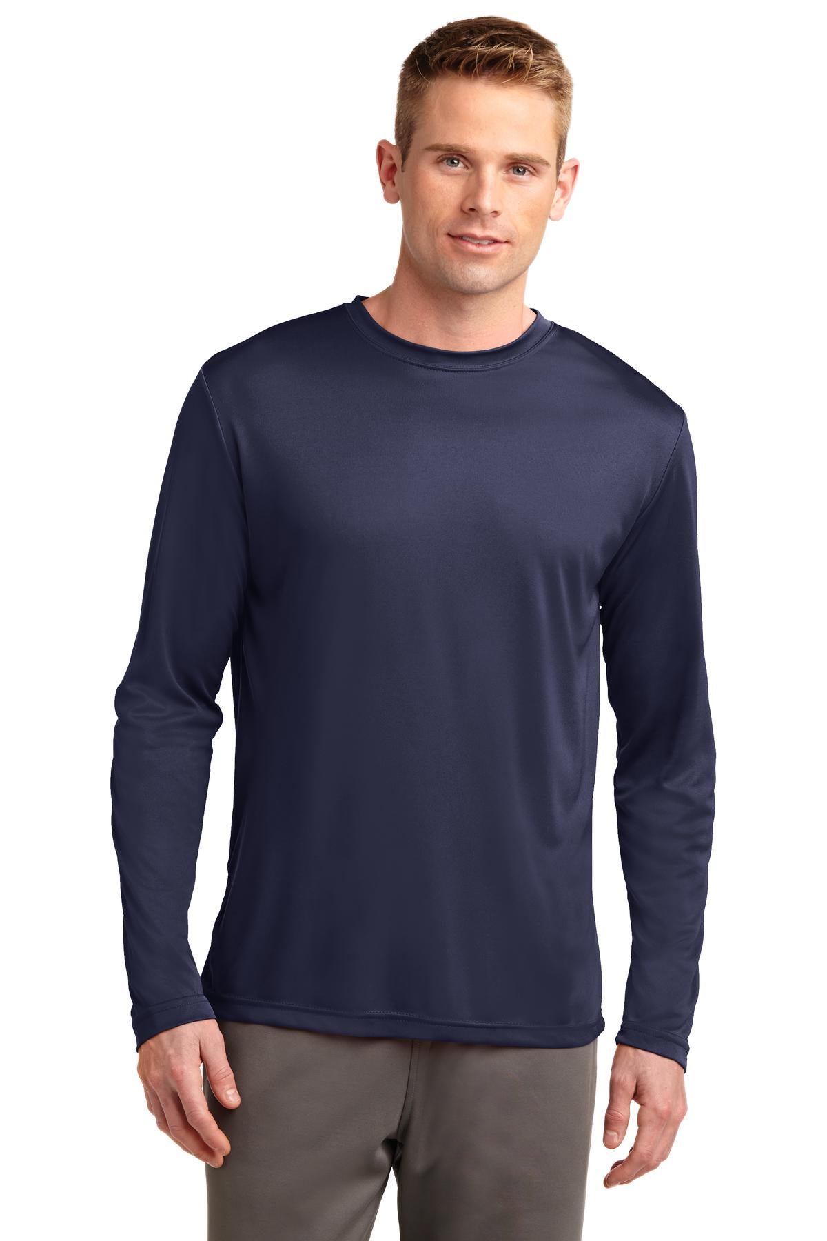 Tall male model 6,4 wearing a true navy sport tek long sleeve T shirt 100% poly Tee with removable tag for comfort against a white background