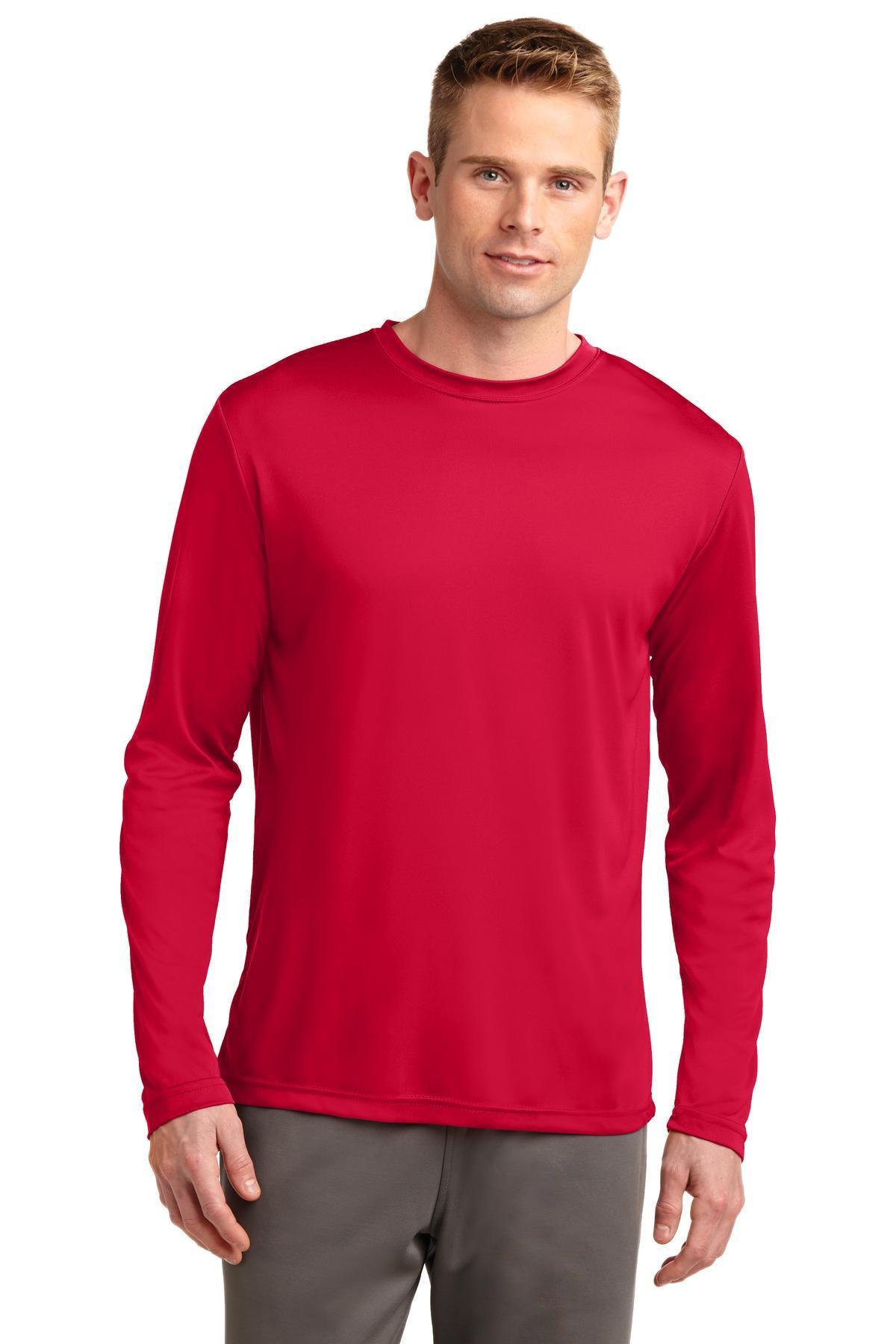 Tall male model 6,4 wearing a true red sport tek long sleeve T shirt 100% poly Tee with removable tag for comfort against a white background