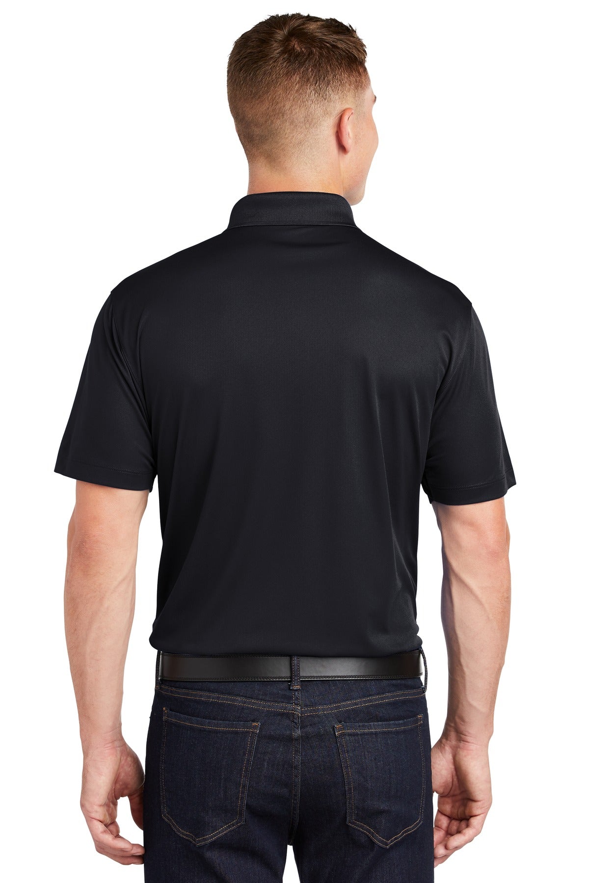 Tall male model 6'4 wearing a medium sport tek polo t shirt in Black 100% polyester tee with dyed buttons showing the back of the shirt against a white background