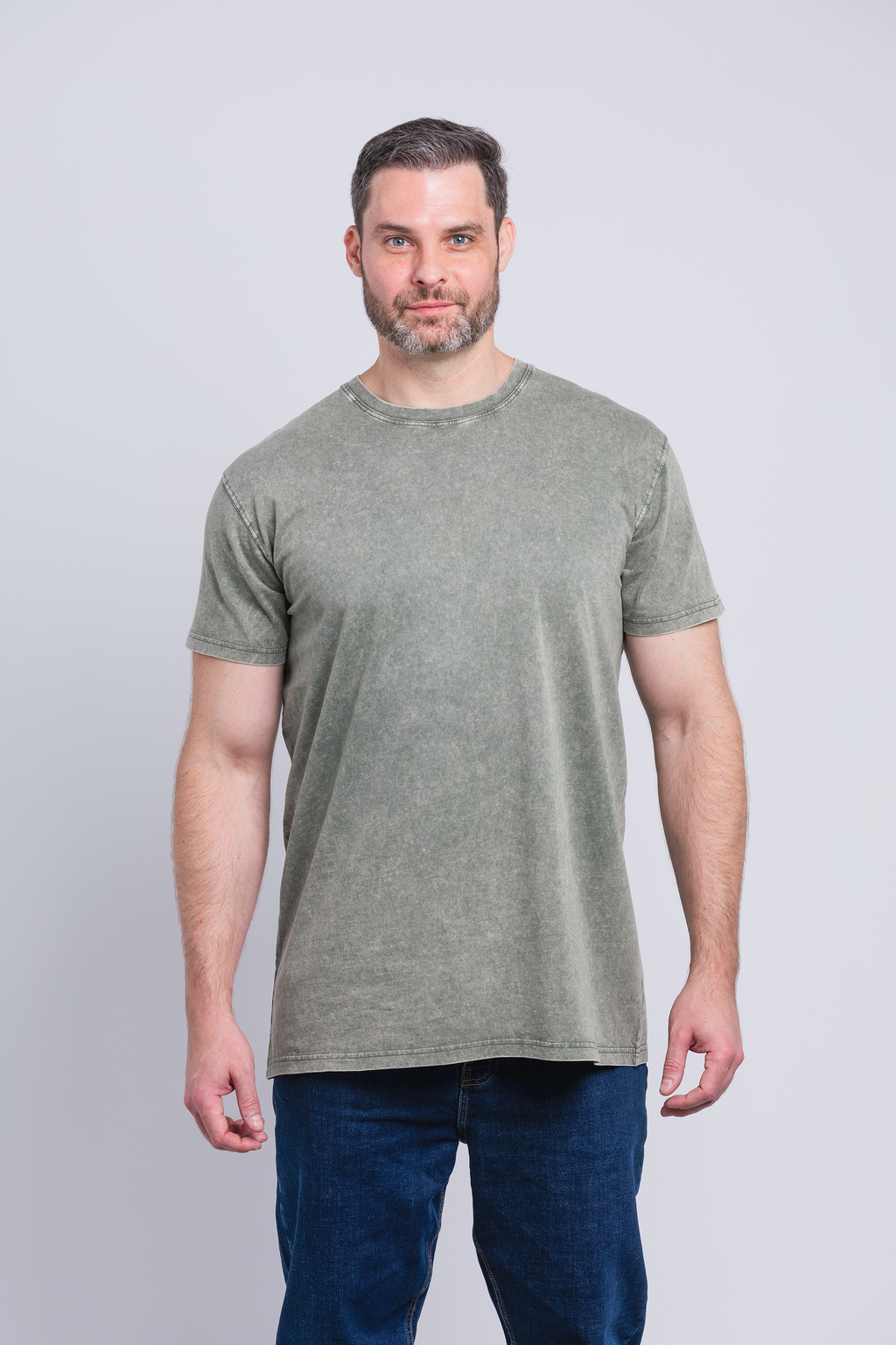 Tall male model 6,2 wearing a medium army Have It Tall vintage stone washed T shirt drier and washer safe tee against a white background