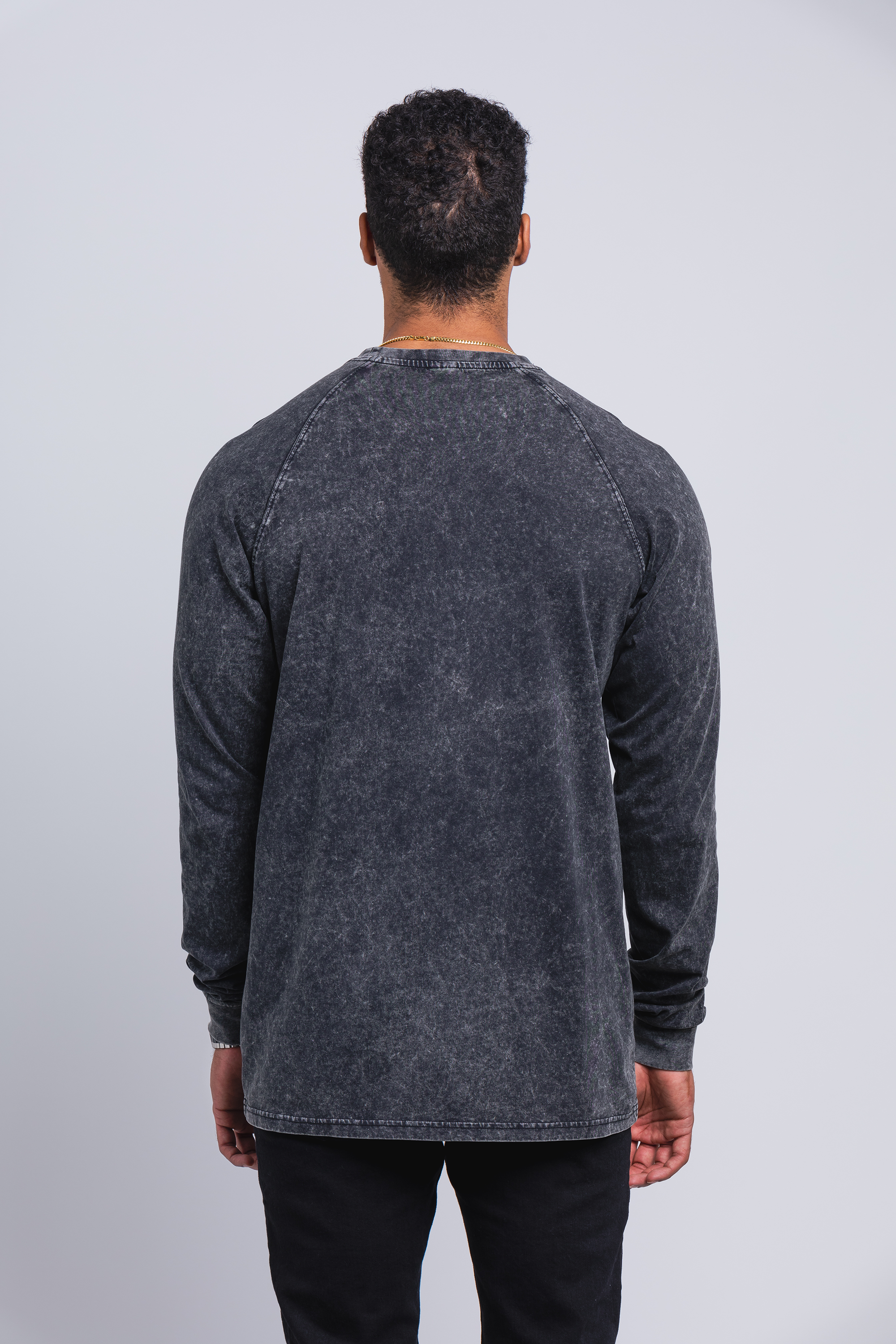 tall male model 6'5 wearing a large Have It Tall Raglan Long Sleeve Vintage Stone Wash 100% cotton preshrunk shirt showing the back of the shirt against a white background.